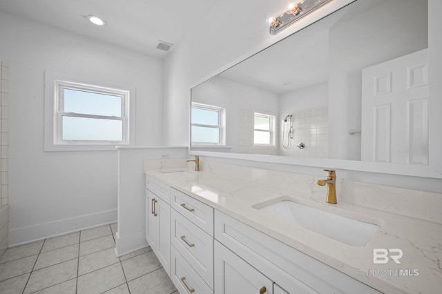 bathroom with plenty of natural light, a sink, and tile patterned floors