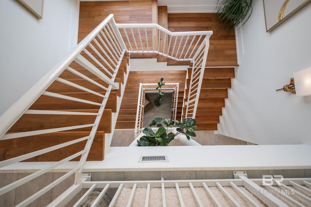 staircase featuring visible vents