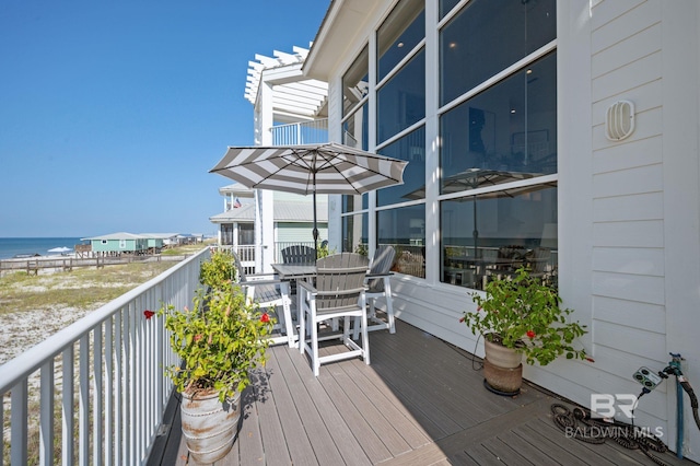 wooden terrace with a water view