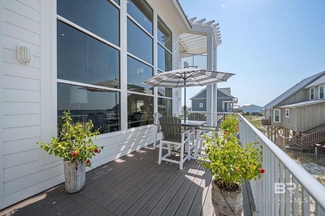 wooden terrace featuring a residential view