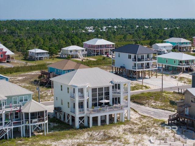 aerial view featuring a wooded view