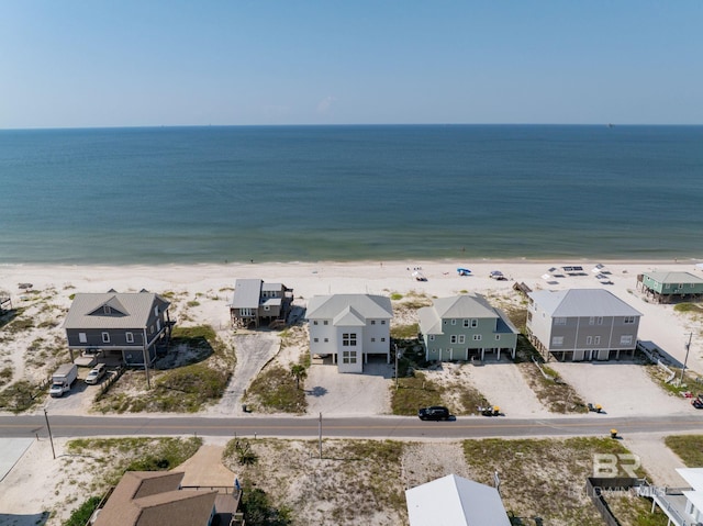 aerial view featuring a residential view, a water view, and a beach view