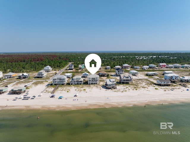 birds eye view of property featuring a water view and a view of the beach