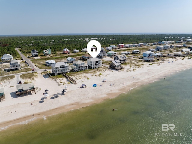 aerial view featuring a water view and a beach view