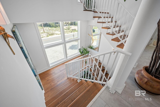 staircase featuring wood finished floors