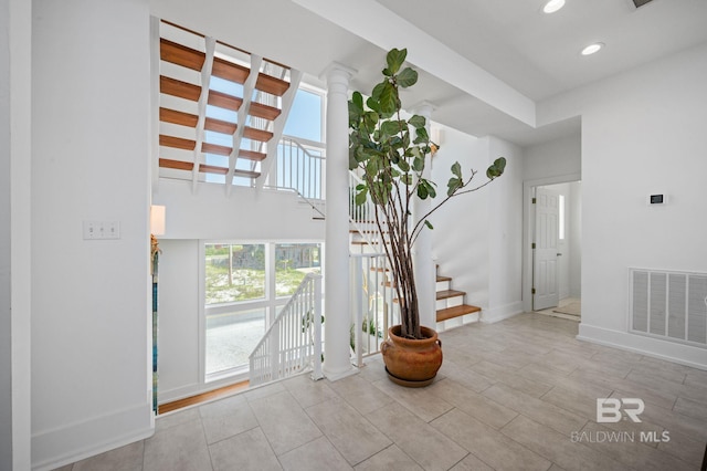 interior space featuring stairway, recessed lighting, visible vents, and baseboards