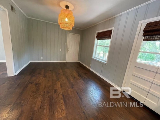 interior space with crown molding and dark hardwood / wood-style floors