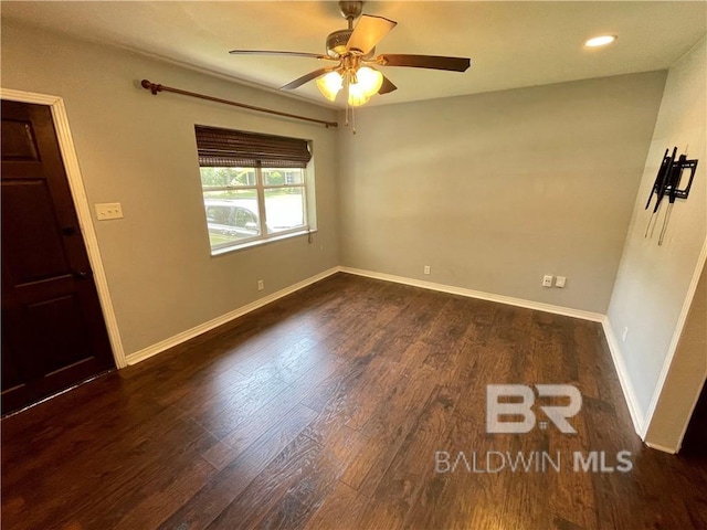 unfurnished room with ceiling fan and dark hardwood / wood-style floors