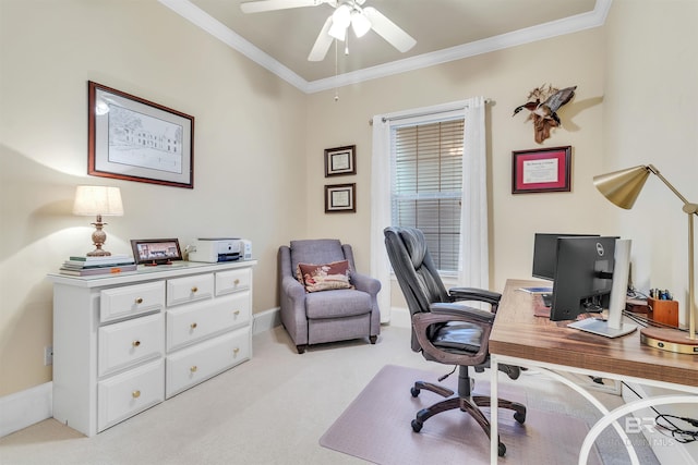 office with light colored carpet, ceiling fan, crown molding, and baseboards
