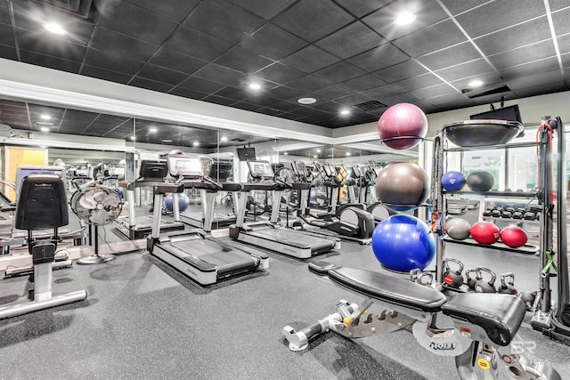 gym featuring visible vents and a drop ceiling