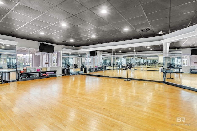 exercise room with visible vents and wood finished floors