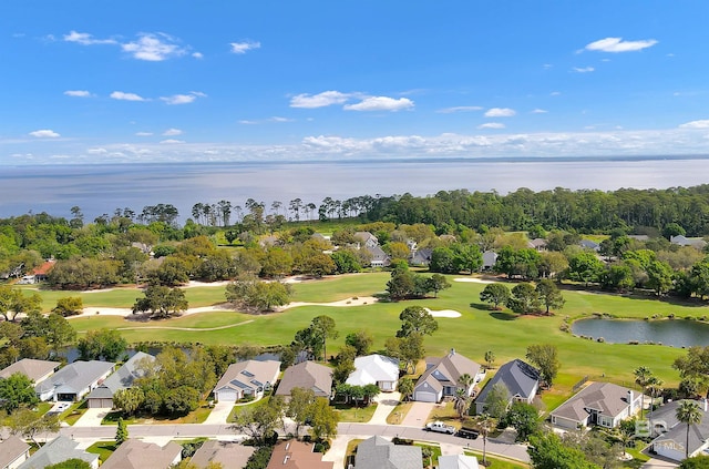 bird's eye view with a water view, a residential view, and view of golf course