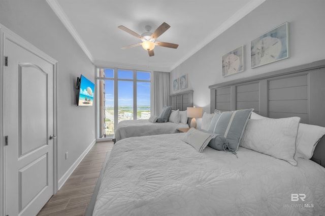 23008 Perdido Beach Blvd Unit 1005, Orange Beach, AL 36561 - bedroom featuring ornamental molding, wood finished floors, and a ceiling fan