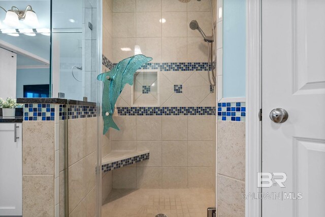 bathroom featuring a shower stall