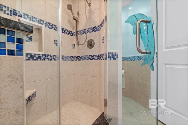 bathroom featuring a shower stall