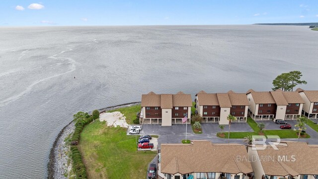 aerial view of residential area with a large body of water