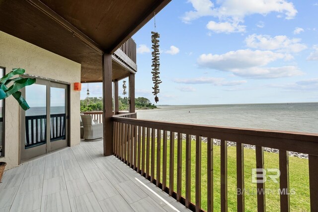 balcony featuring a water view