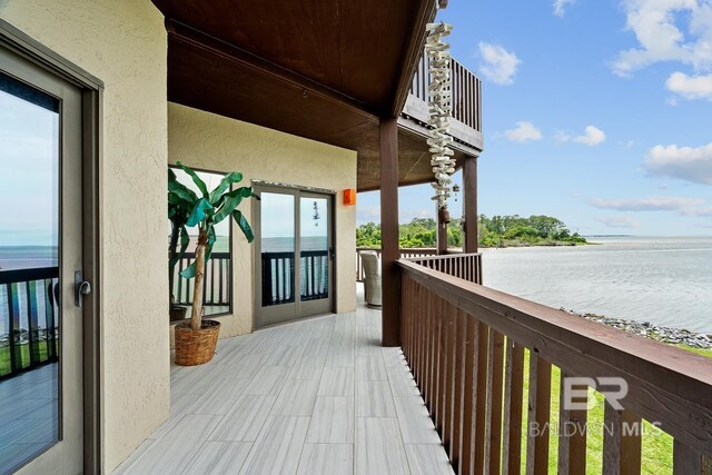 balcony featuring a water view