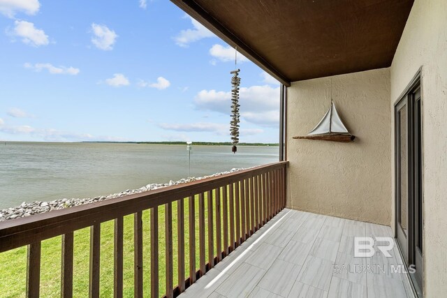 balcony featuring a water view