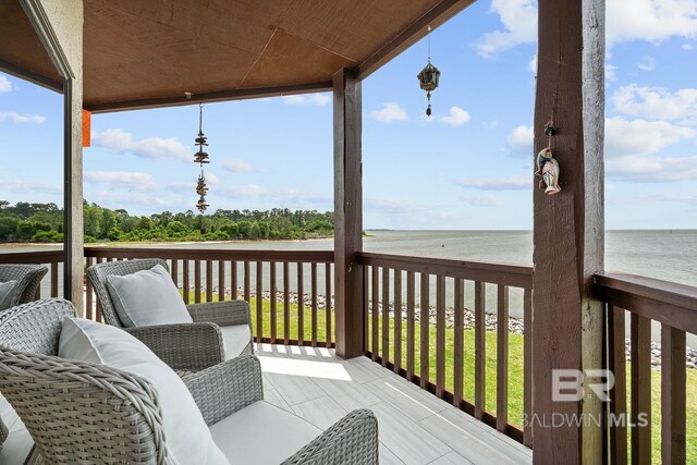 deck featuring a water view