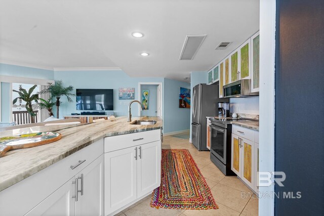 kitchen featuring stainless steel appliances, a sink, white cabinetry, ornamental molding, and light stone countertops