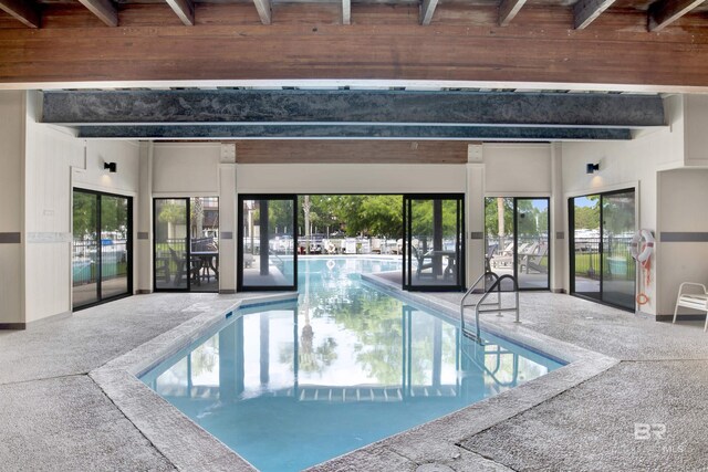indoor community pool with a patio