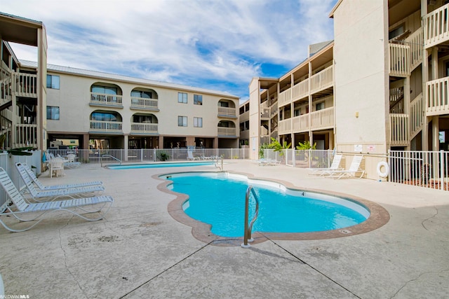 view of swimming pool with a patio