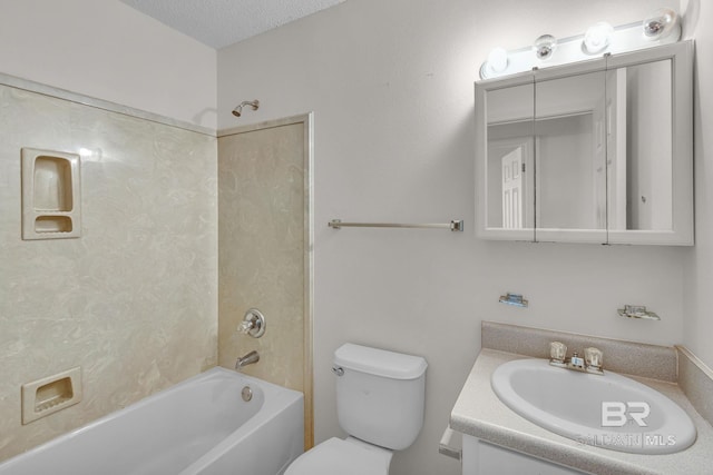 full bathroom featuring vanity, a textured ceiling, toilet, and washtub / shower combination