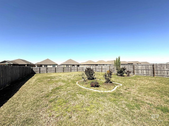 view of yard featuring a fenced backyard