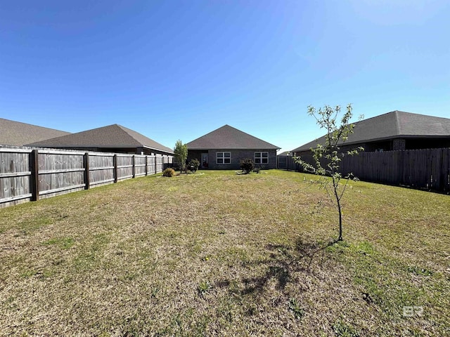 view of yard featuring a fenced backyard