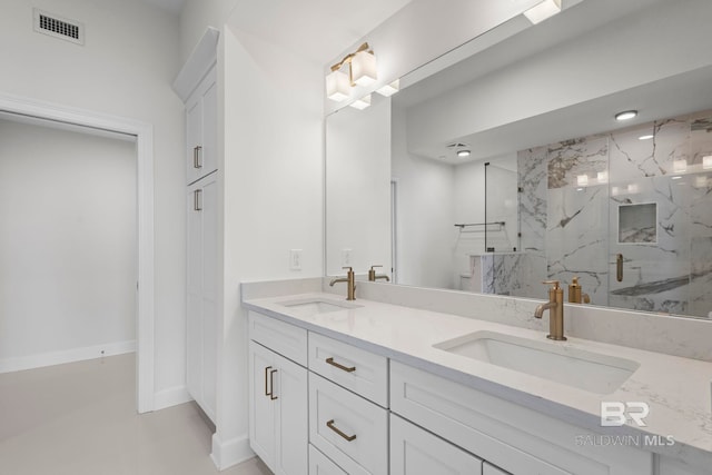 533 E Beach Blvd Unit 1905, Gulf Shores, AL 36542 - bathroom with double vanity and a marble finish shower