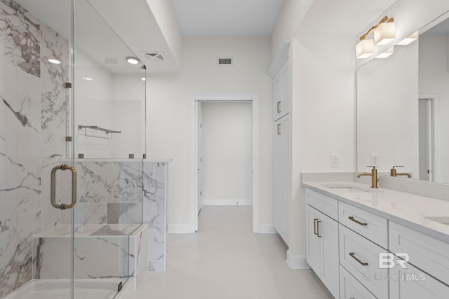 533 E Beach Blvd Unit 1905, Gulf Shores, AL 36542 - full bath with a marble finish shower, double vanity, tile patterned floors, and baseboards
