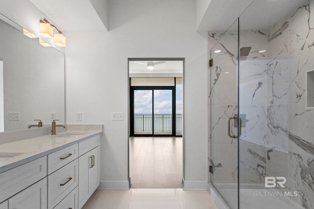 533 E Beach Blvd Unit 1905, Gulf Shores, AL 36542 - bathroom with double vanity, a marble finish shower, and baseboards