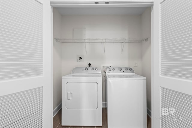 533 E Beach Blvd Unit 1905, Gulf Shores, AL 36542 - laundry area featuring washing machine and clothes dryer, wood finished floors, and baseboards