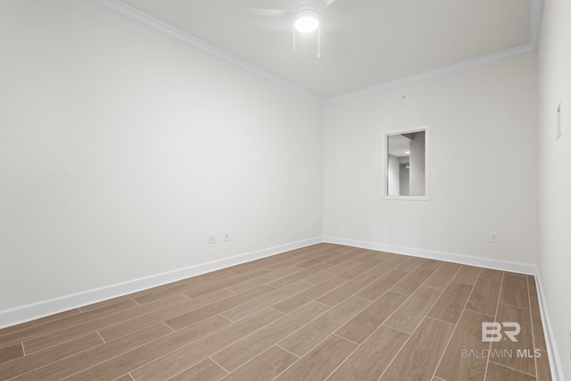 533 E Beach Blvd Unit 1905, Gulf Shores, AL 36542 - spare room featuring ceiling fan, crown molding, wood finished floors, and baseboards