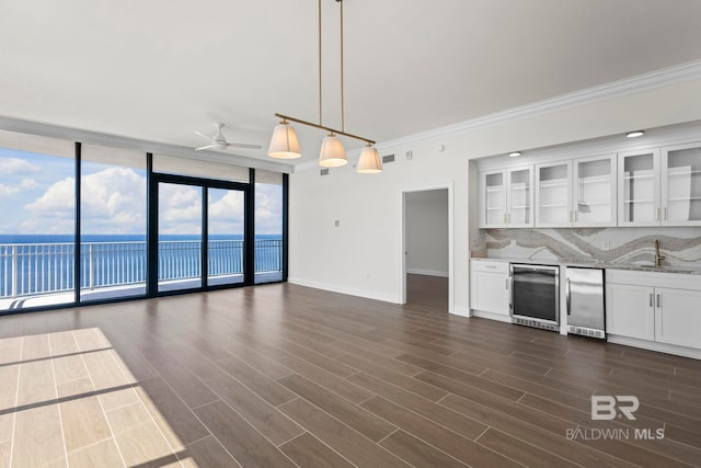 533 E Beach Blvd Unit 1905, Gulf Shores, AL 36542 - kitchen with refrigerator, expansive windows, wine cooler, ceiling fan, and white cabinets