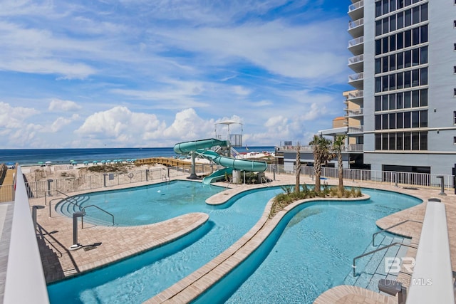 533 E Beach Blvd Unit 1905, Gulf Shores, AL 36542 - community pool featuring a water slide, a water view, and a patio