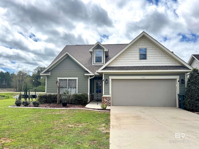 1030 Crown Walk Dr, Foley, AL 36535 - view of front facade with a front lawn, driveway, roof with shingles, an attached garage, and brick siding