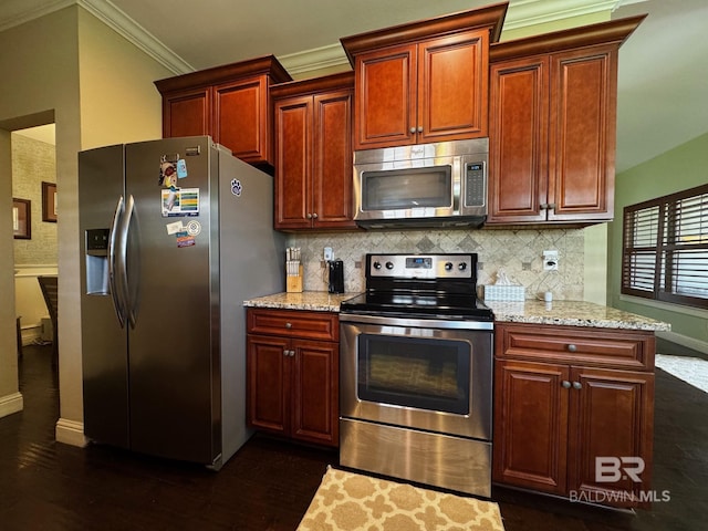 1030 Crown Walk Dr, Foley, AL 36535 - kitchen featuring stainless steel appliances, crown molding, decorative backsplash, light stone countertops, and dark wood-style floors