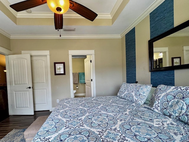 1030 Crown Walk Dr, Foley, AL 36535 - bedroom featuring wood finished floors, a tray ceiling, crown molding, ensuite bathroom, and ceiling fan