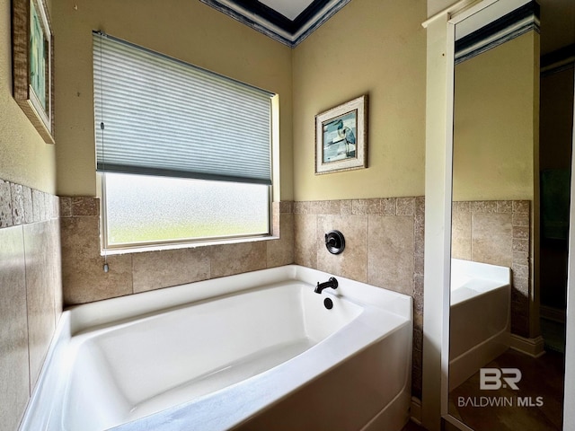 1030 Crown Walk Dr, Foley, AL 36535 - bathroom with a garden tub and tile walls