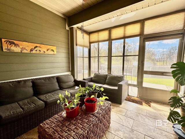 1030 Crown Walk Dr, Foley, AL 36535 - sunroom with stone tile flooring, wooden walls, and beamed ceiling