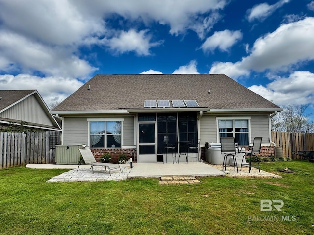 1030 Crown Walk Dr, Foley, AL 36535 - rear view of house with a patio, a sunroom, solar panels, and brick siding