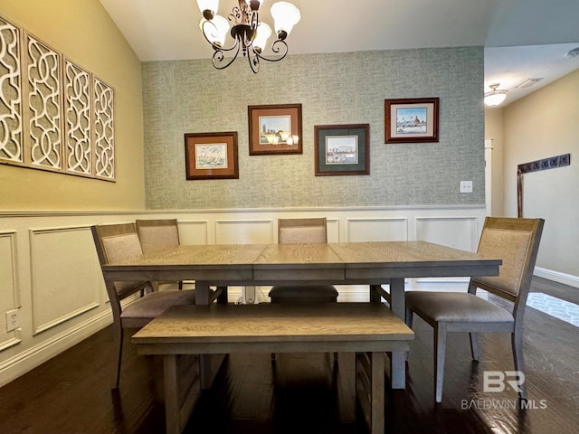 1030 Crown Walk Dr, Foley, AL 36535 - dining area featuring a chandelier, dark wood-style floors, a wainscoted wall, and a decorative wall