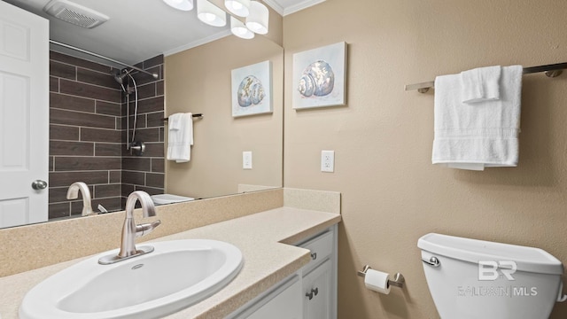 24132 Perdido Beach Blvd Unit 1011, Orange Beach, AL 36561 - full bath featuring crown molding, a tile shower, vanity, and toilet