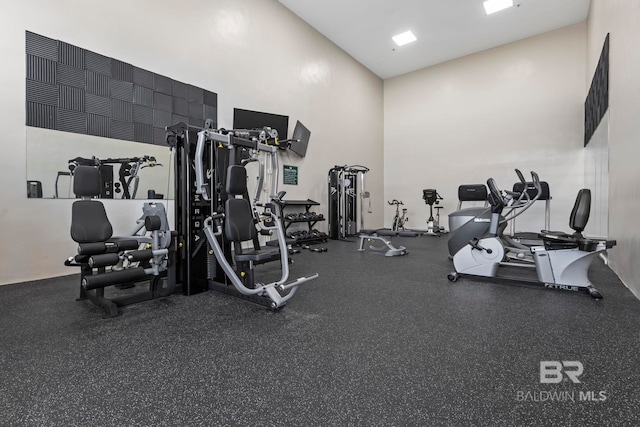24132 Perdido Beach Blvd Unit 1011, Orange Beach, AL 36561 - exercise room featuring a towering ceiling