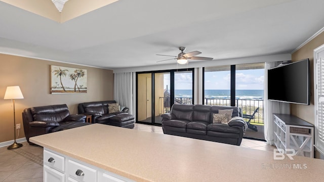 24132 Perdido Beach Blvd Unit 1011, Orange Beach, AL 36561 - living room featuring ceiling fan, light tile patterned flooring, ornamental molding, and baseboards
