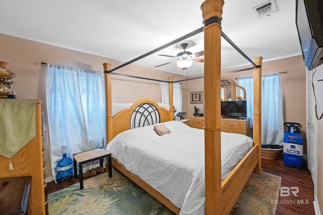 bedroom featuring ceiling fan and dark hardwood / wood-style flooring