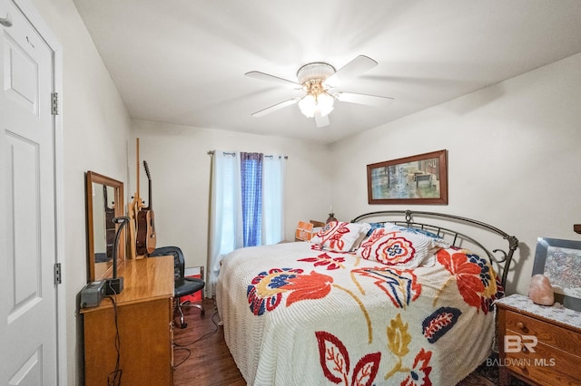 bedroom with ceiling fan and dark wood-type flooring