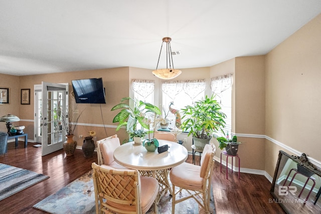 dining room featuring dark wood-type flooring